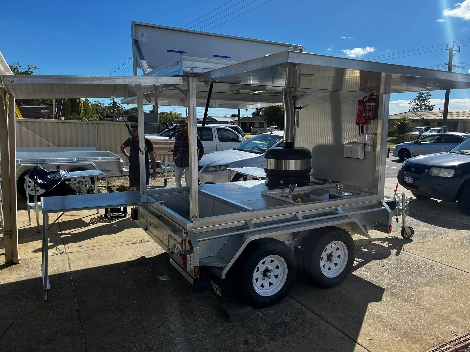 Fold-out pizza food truck with heavy-duty build and commercial pizza oven installation