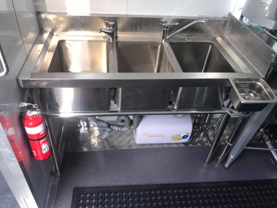 Professional food truck kitchen setup with space-efficient design and equipment installation